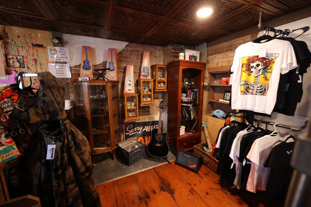 Shop interior with ukuleles, band tees and merchandise